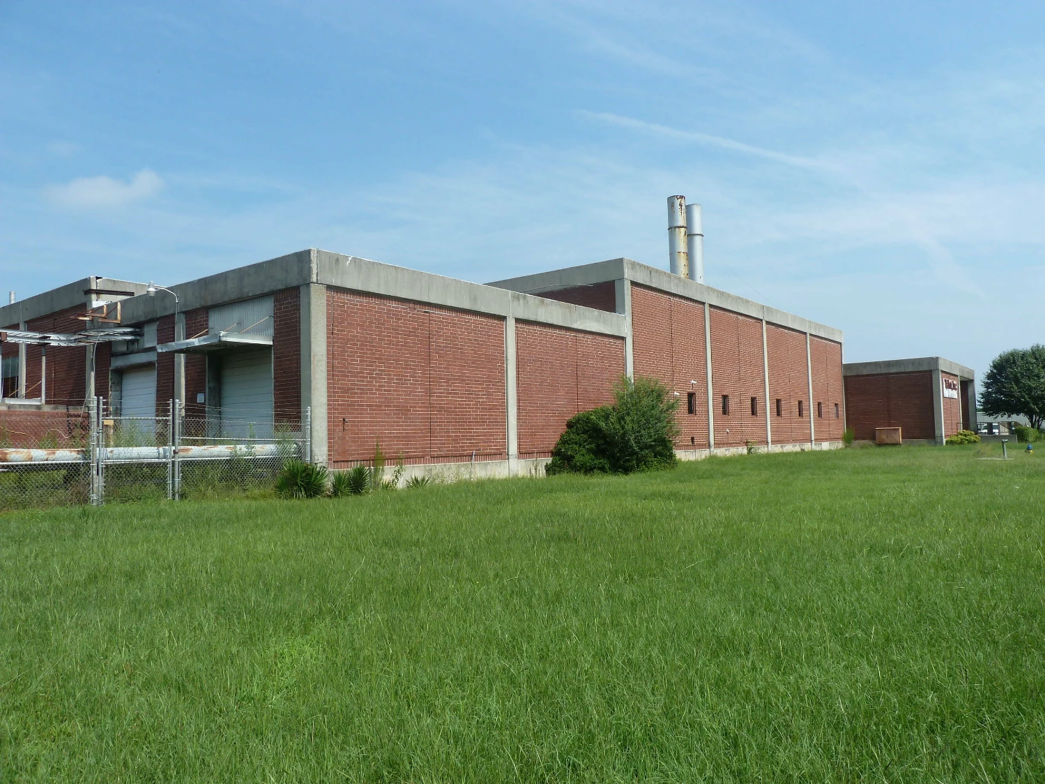 Former Talon Zipper Manufacturing/Warehouse - 105,251 SF - Adjacent to Runway with Potential IOS Land - 20 +/- Acres - Opportunity Zone - OWNER FINANCING 