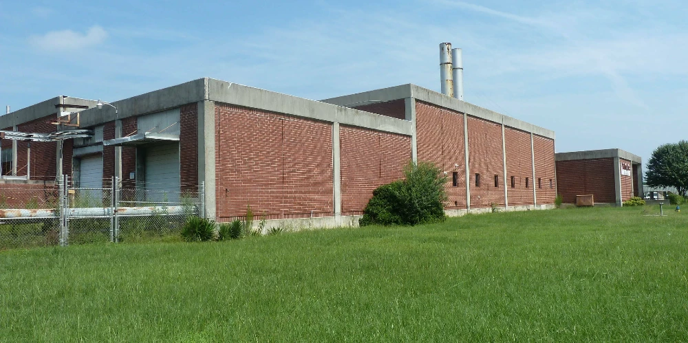 Former Talon Zipper Manufacturing/Warehouse - 105,251 SF - Adjacent to Runway with Potential IOS Land - 20 +/- Acres - Opportunity Zone - OWNER FINANCING 