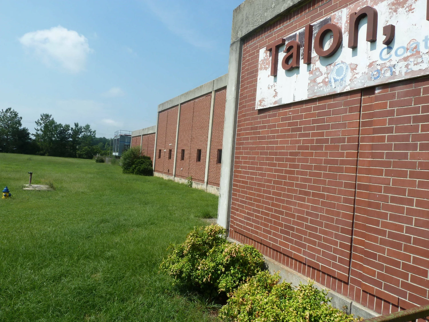 Former Talon Zipper Manufacturing/Warehouse - 105,251 SF - Adjacent to Runway with Potential IOS Land - 20 +/- Acres - Opportunity Zone - OWNER FINANCING 