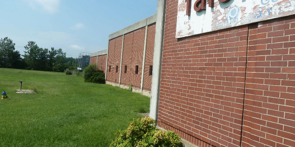 Former Talon Zipper Manufacturing/Warehouse - 105,251 SF - Adjacent to Runway with Potential IOS Land - 20 +/- Acres - Opportunity Zone - OWNER FINANCING 