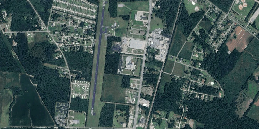 Former Talon Zipper Manufacturing/Warehouse - 105,251 SF - Adjacent to Runway with Potential IOS Land - 20 +/- Acres - Opportunity Zone - OWNER FINANCING 