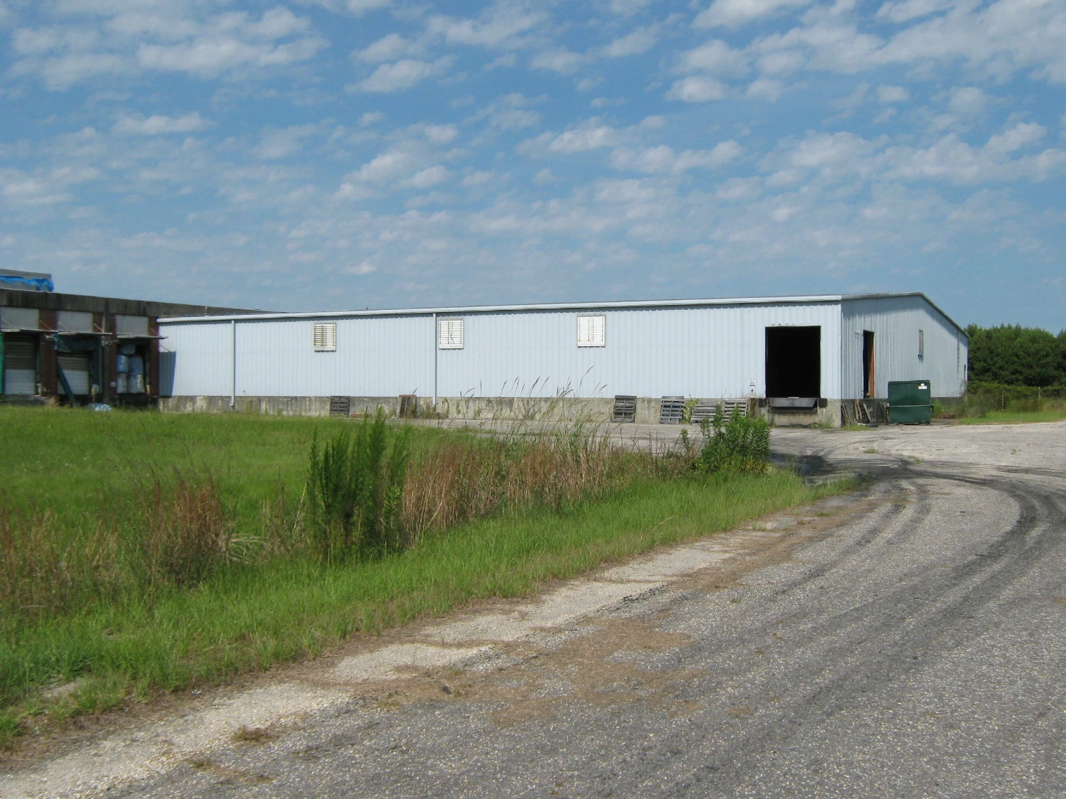 Former Talon Zipper Manufacturing/Warehouse - 105,251 SF - Adjacent to Runway with Potential IOS Land - 20 +/- Acres - Opportunity Zone - OWNER FINANCING 