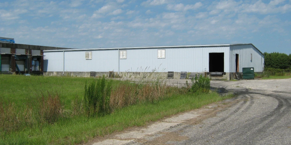 Former Talon Zipper Manufacturing/Warehouse - 105,251 SF - Adjacent to Runway with Potential IOS Land - 20 +/- Acres - Opportunity Zone - OWNER FINANCING 