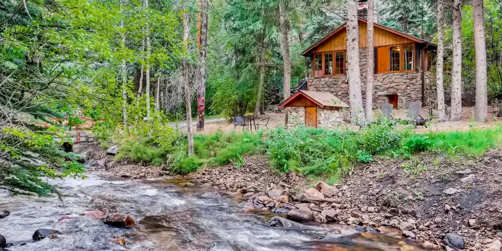 Water & Stone Cabins | 14-Keys | C-3 Zoning | Live Creek Frontage | 6.7 CAP