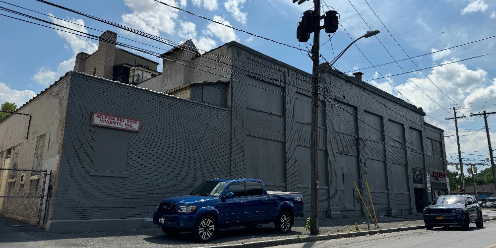 Syracuse Mixed-Use Corner Building – Retail Income + Residential Conversion