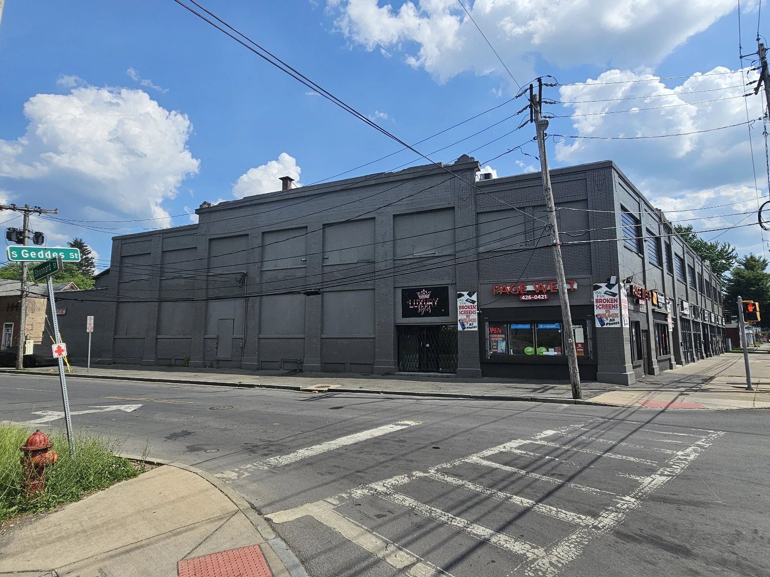 Syracuse Mixed-Use Corner Building – Retail Income + Residential Conversion