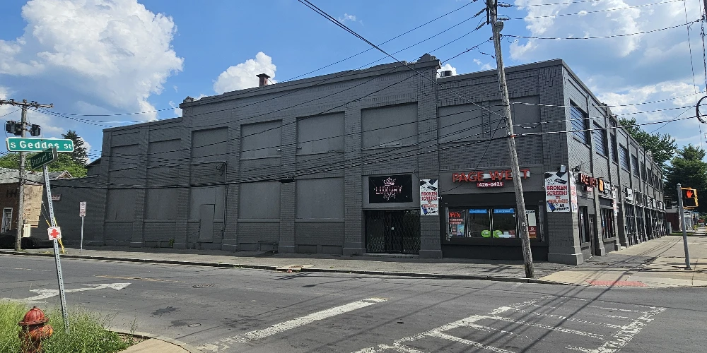 Syracuse Mixed-Use Corner Building – Retail Income + Residential Conversion